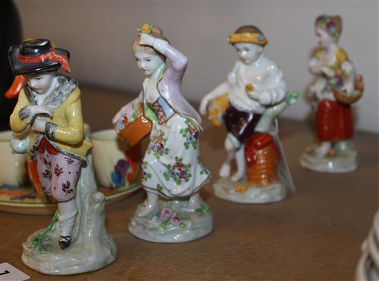 Four Sitzendorf figures emblematic of the seasons, blue printed factory marks to bases